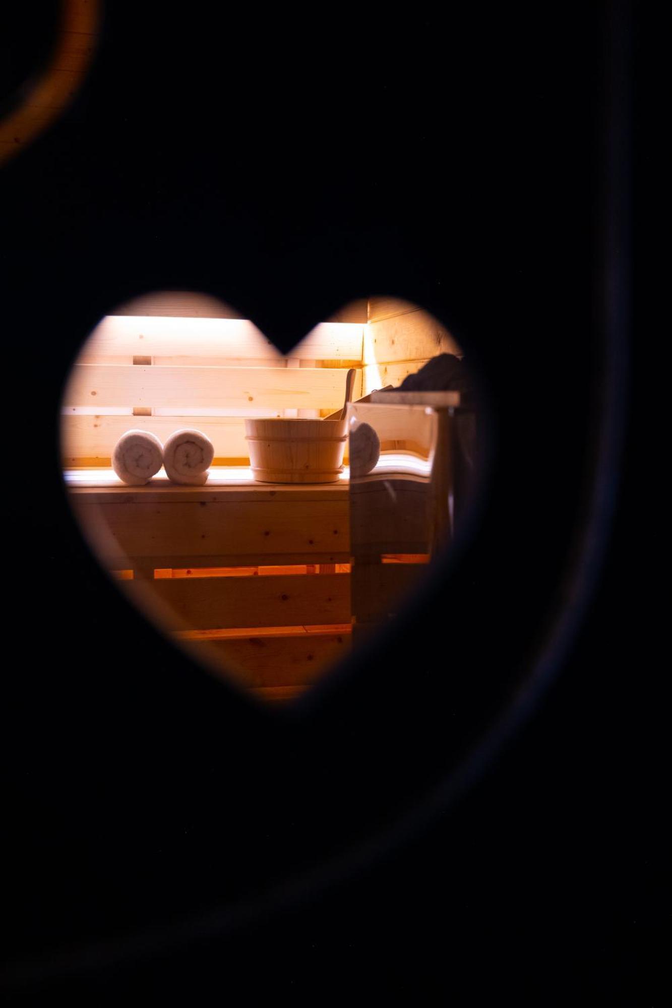 Arka Art Hotel Tirana Eksteriør billede A heart-shaped hole in a sauna door